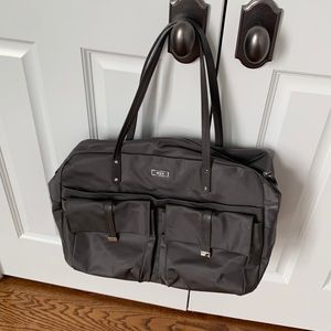 Tumi bag - weekender or office/ travel, very light, spacious, well organized.